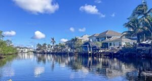 17 Amazing Warm Places to Visit in February in 2026 This image captures a warm February escape to the Florida Keys, where calm waterfront canals, palm trees, and sunny blue skies create the perfect winter getaway. The peaceful coastal homes and tropical setting highlight why the Keys are one of the best warm places to visit in February. With mild temperatures and relaxed island vibes, it’s an ideal destination for couples, families, and anyone craving sunshine.