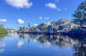 17 Amazing Warm Places to Visit in February in 2026 This image captures a warm February escape to the Florida Keys, where calm waterfront canals, palm trees, and sunny blue skies create the perfect winter getaway. The peaceful coastal homes and tropical setting highlight why the Keys are one of the best warm places to visit in February. With mild temperatures and relaxed island vibes, it’s an ideal destination for couples, families, and anyone craving sunshine.