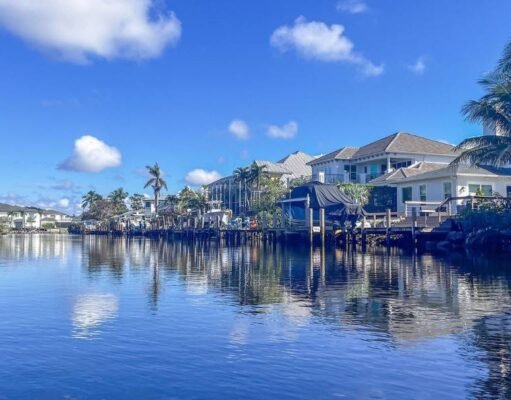 17 Amazing Warm Places to Visit in February in 2026 This image captures a warm February escape to the Florida Keys, where calm waterfront canals, palm trees, and sunny blue skies create the perfect winter getaway. The peaceful coastal homes and tropical setting highlight why the Keys are one of the best warm places to visit in February. With mild temperatures and relaxed island vibes, it’s an ideal destination for couples, families, and anyone craving sunshine.