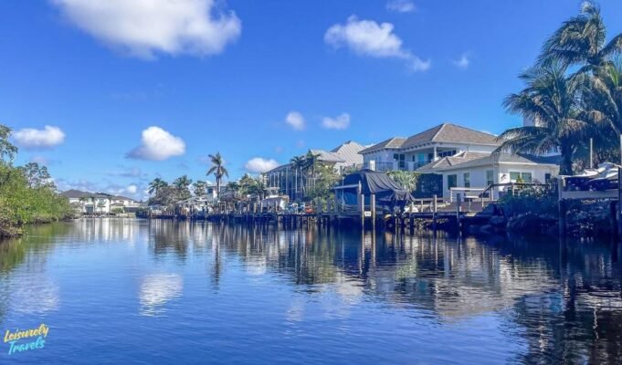 17 Amazing Warm Places to Visit in February in 2026 This image captures a warm February escape to the Florida Keys, where calm waterfront canals, palm trees, and sunny blue skies create the perfect winter getaway. The peaceful coastal homes and tropical setting highlight why the Keys are one of the best warm places to visit in February. With mild temperatures and relaxed island vibes, it’s an ideal destination for couples, families, and anyone craving sunshine.