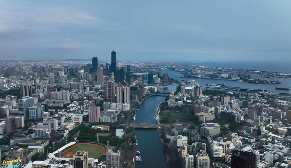 A scenic aerial view showcasing one of the best places to travel in March, featuring a vibrant city skyline and waterfront landscape. This image highlights ideal March travel weather with clear skies and coastal charm. Perfect inspiration for spring getaways, warm-weather escapes, and global travel destinations in 2026.
