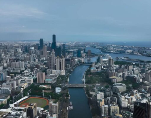 Where to Travel in March: 15 Best Places to Travel in 2026 A scenic aerial view showcasing one of the best places to travel in March, featuring a vibrant city skyline and waterfront landscape. This image highlights ideal March travel weather with clear skies and coastal charm. Perfect inspiration for spring getaways, warm-weather escapes, and global travel destinations in 2026.