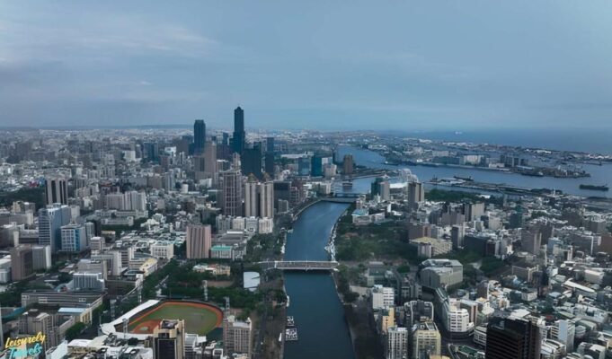 Where to Travel in March: 15 Best Places to Travel in 2026 A scenic aerial view showcasing one of the best places to travel in March, featuring a vibrant city skyline and waterfront landscape. This image highlights ideal March travel weather with clear skies and coastal charm. Perfect inspiration for spring getaways, warm-weather escapes, and global travel destinations in 2026.