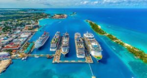 The Best Babymoon Destinations by Month of the Year in 2026 A stunning aerial view shows luxury cruise ships docked in clear turquoise waters near tropical islands. The white-sand beaches and vibrant blue ocean create a peaceful, dreamy atmosphere. It’s the perfect warm-weather escape for couples seeking relaxation and unforgettable moments.